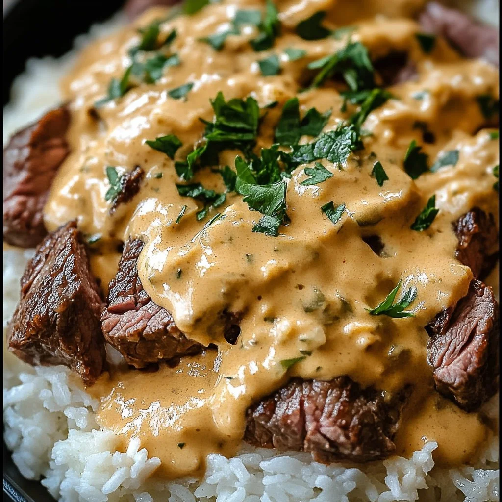 Delicious bowl of Steak Queso Rice with tender steak, creamy queso, and fluffy rice