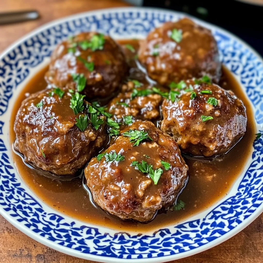 Savory Salisbury steak meatballs served with rich gravy and vegetables