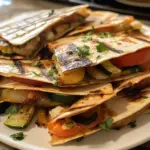 Grilled Mediterranean vegetable quesadillas served with a side of salsa